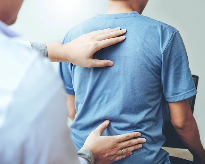 Chiropractor adjusting a patient's spine, with additional focus on exercise recommendations, physical therapy, and holistic health guidance.