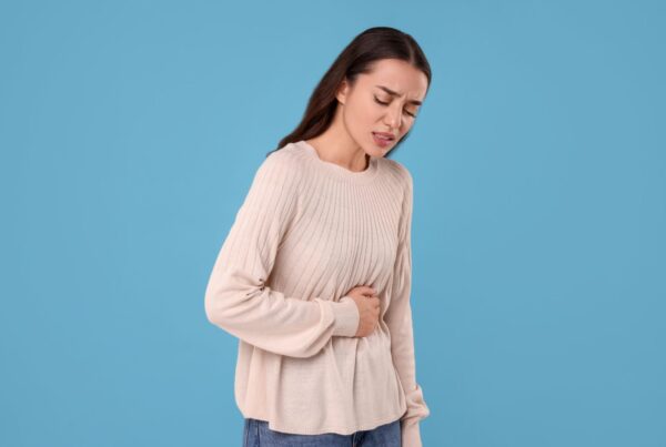 Patient experiencing abdominal bloating due to SIBO seeking functional medicine treatment in Virginia Beach