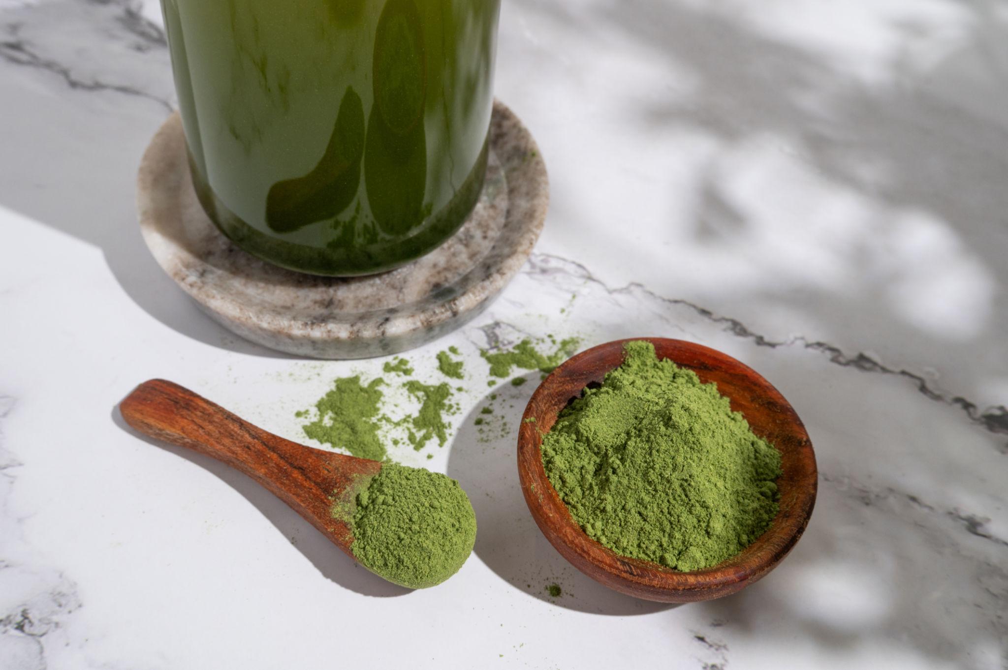 Greens powder spirulina and chlorella with fresh green vegetables